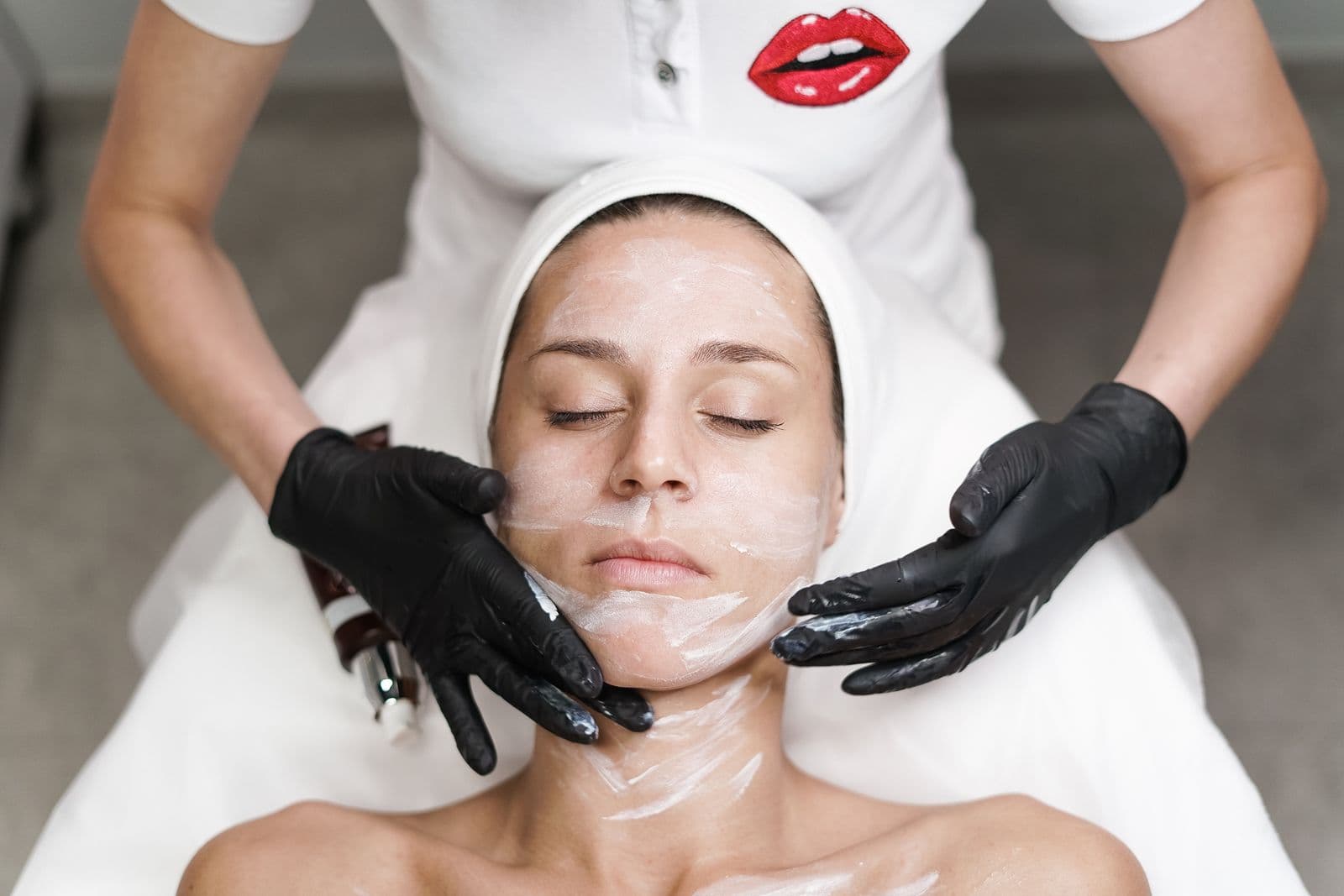A facial treatment being applied to a client